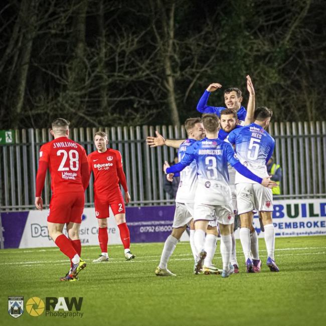 Elliott Dugan is mobbed as he celebrates scoring early goal for Haverfordwest County